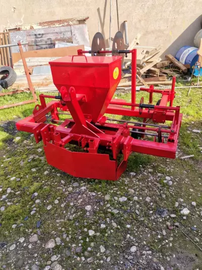 Potato and onion planting and harvesting machine