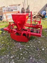 Potato and onion planting and harvesting machine